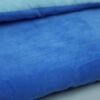 blue-kids-sleeping-bag-fabric-detail Light blue lining folded over blue sleeping bag fabric