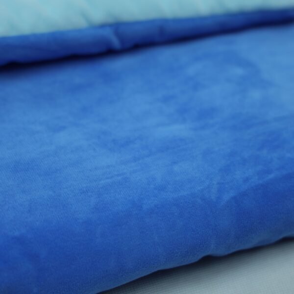 blue-kids-sleeping-bag-fabric-detail Light blue lining folded over blue sleeping bag fabric