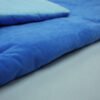 blue-kids-sleeping-bag-seam-detail Close-up of blue sleeping bag fabric and edge seam