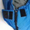 Zipper and hook-and-loop closure on blue down sleeping bag