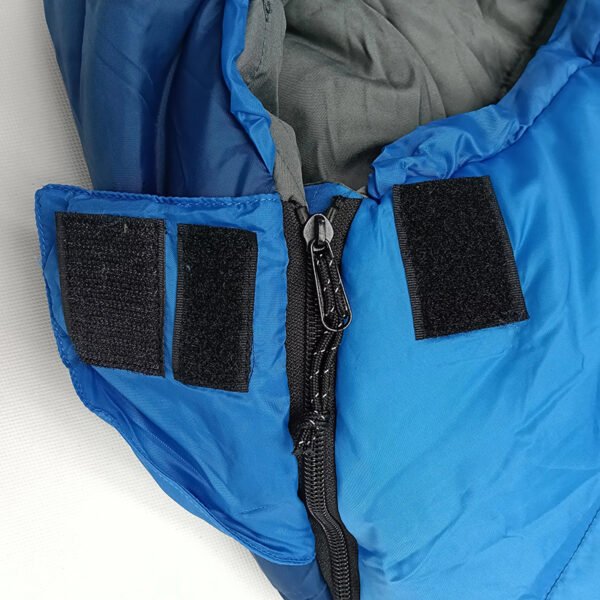 Zipper and hook-and-loop closure on blue down sleeping bag