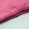 kids-envelope-sleeping-bag-zipper-pull Purple zipper pull and pink fabric edge on kids sleeping bag