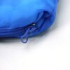 kids-sleeping-bag-zipper-close-up Close-up of zipper pull and blue polyester fabric on a kids sleeping bag