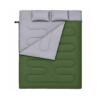 Olive green double sleeping bag with gray lining folded open and two pillows Olive green double sleeping bag with gray lining folded open and two pillows